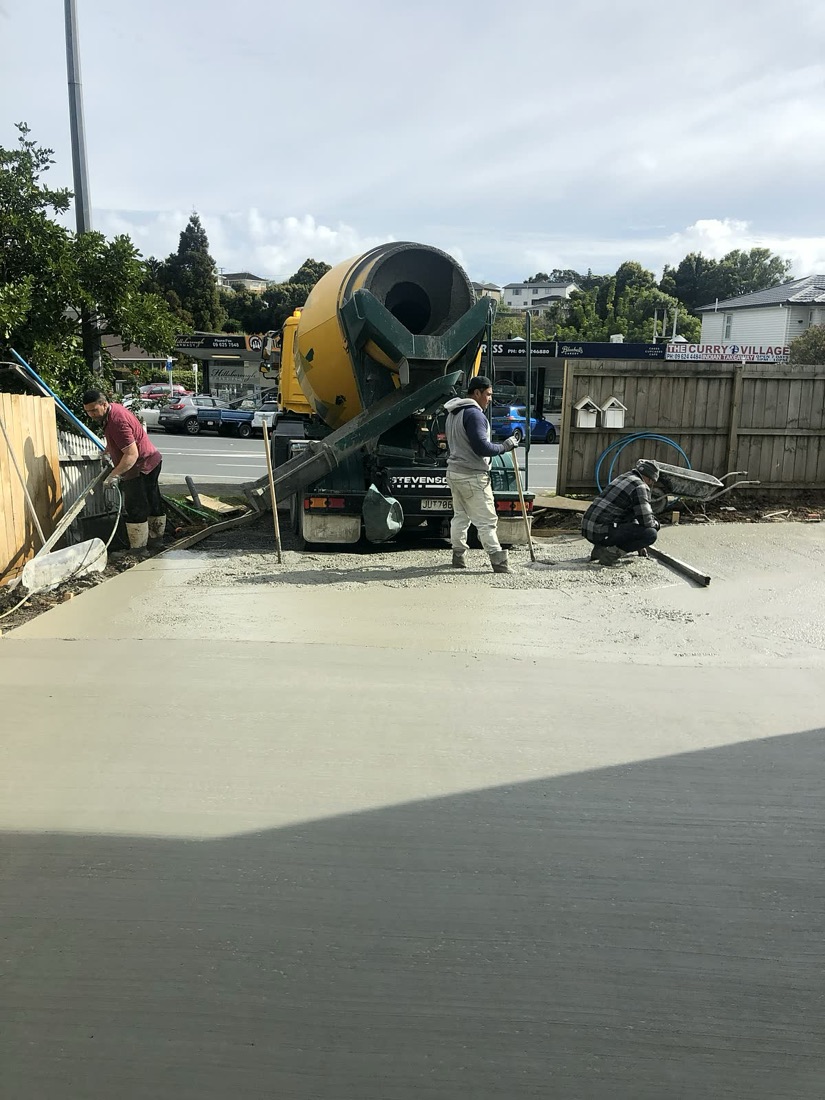 Concrete driveway pour with mixer truck on site