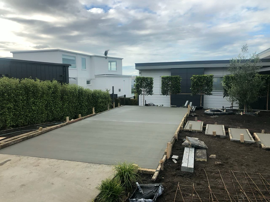 Fresh concrete driveway with garden formwork and edging