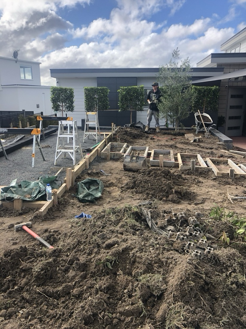 Garden construction site preparation with soil work and formwork