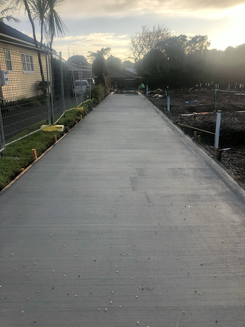 Long concrete driveway access with site services prepared beside it