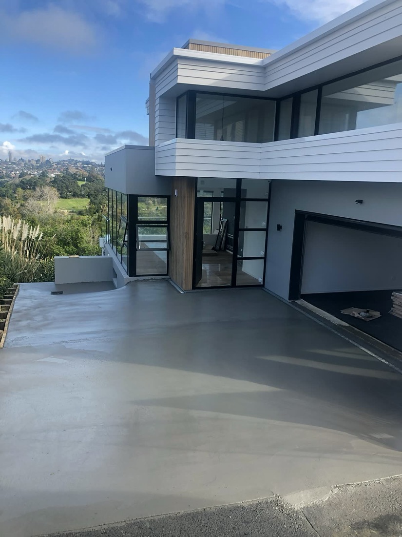 Modern house with smooth concrete driveway access