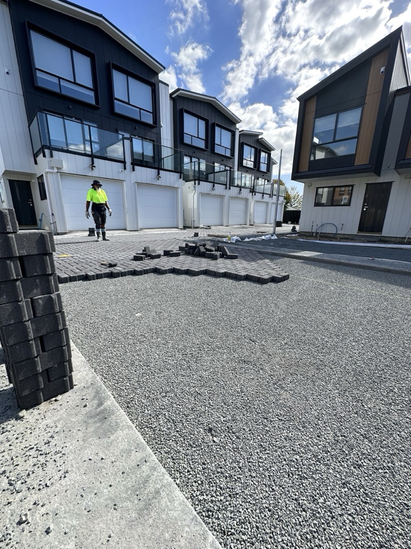 Paver driveway and base preparation outside townhouses