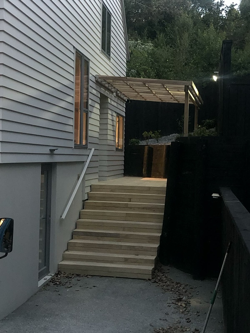 Timber deck stairs with covered entry access